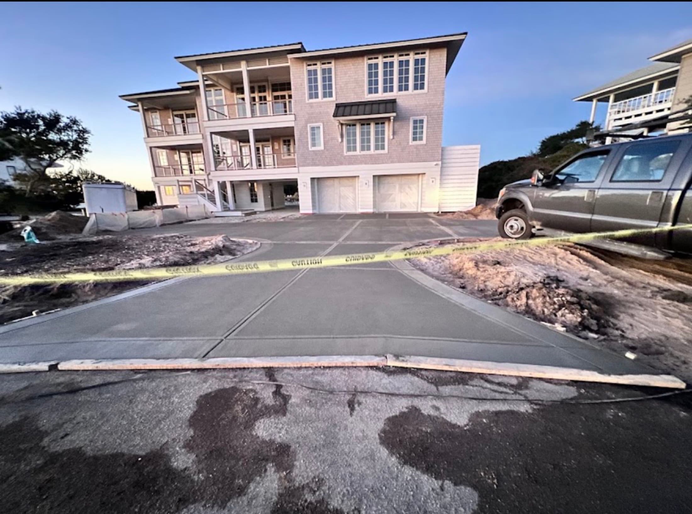 New concrete driveway at a large oceanfront house