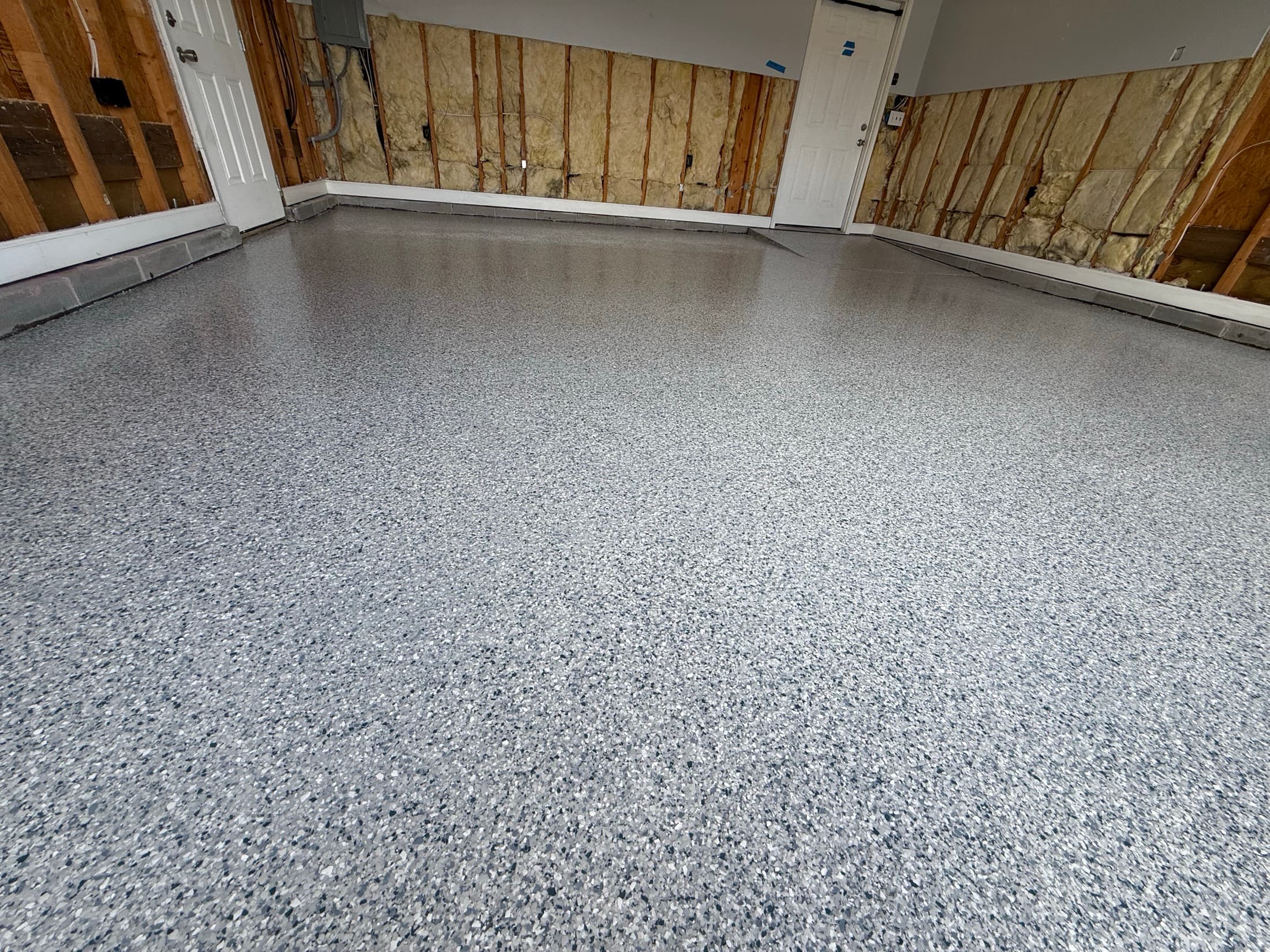 Flake epoxy garage floor seen from the corner