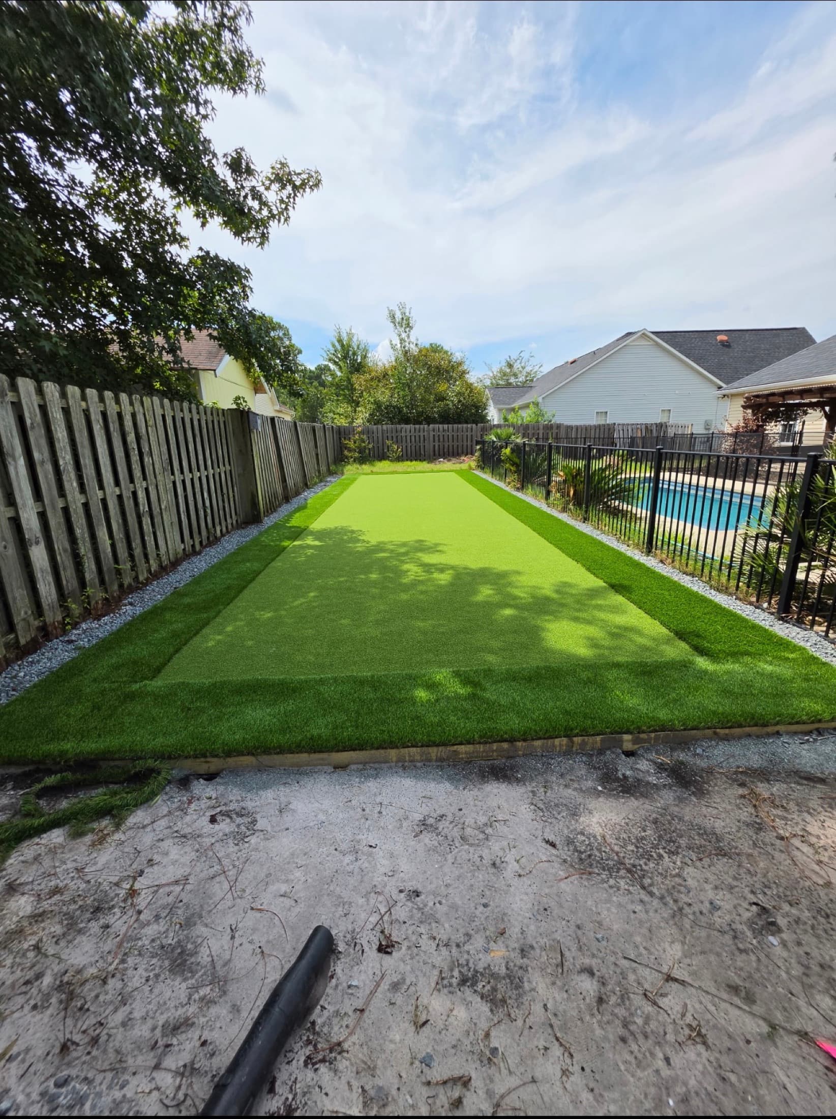 Finished backyard turf build bordered with gravel